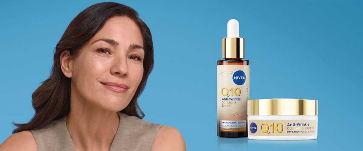 Козметика NIVEA Q10 серум и крем до лице на син фон с жена