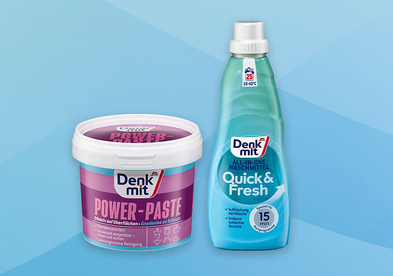 Deterdžent Denkmit Power-Paste i Quick & Fresh na plavoj pozadini