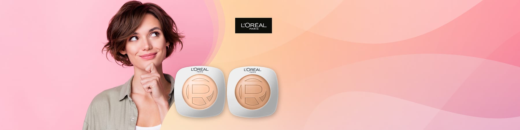 Ženska osoba s kratkom kosom i dva L'Oréal pudera na ružičasto-narančastoj pozadini