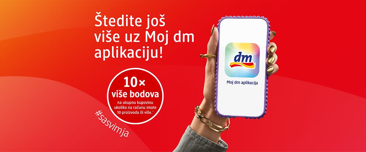 Ruka drži mobitel s logotipom dm aplikacija i tekst o 10x više bodova