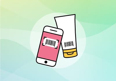 Mobilní telefon a tuba s čárovým kódem na barevném pozadí