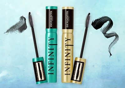 Řasenky Dermacol Infinity s kartáčky a vzorky nanesené řasenky na modrém pozadí