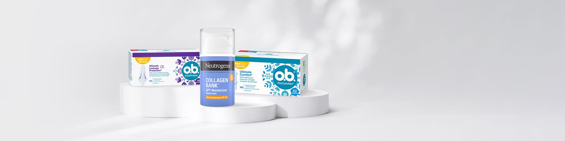 Produkty Neutrogena a o.b. na bílém podstavci