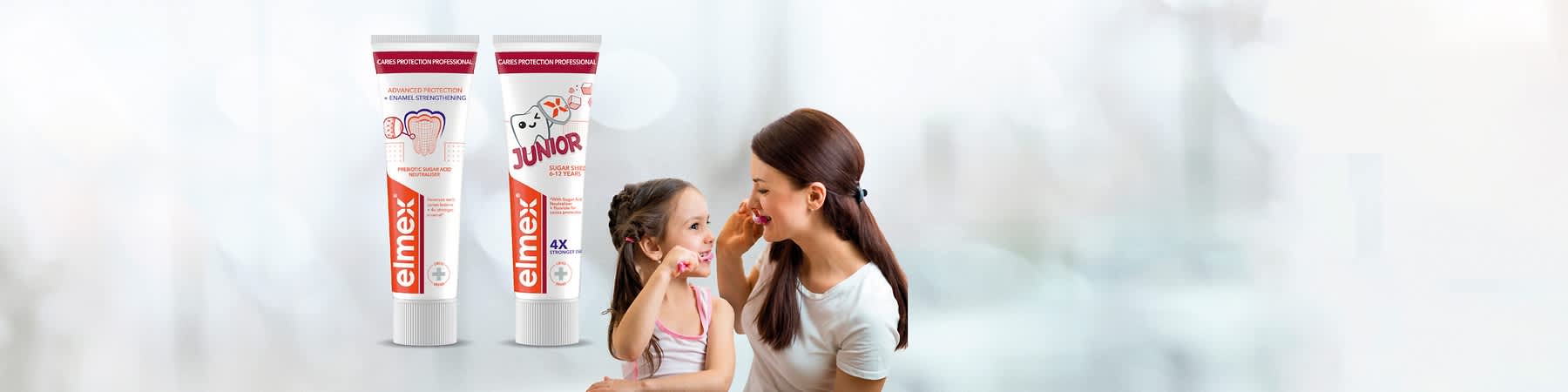 Tubička a krabička zubní pasty Elmex Sensitive Professional Repair & Prevent na světlém pozadí