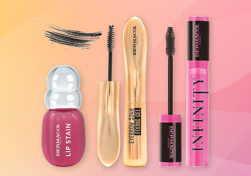 Čtyři kosmetické produkty na růžovo-oranžovém pozadí: vlevo růžový Dermacol Lip Stain s bílým uzávěrem a nápisem „DERMACOL LIP STAIN“, vedle dvě černé kartáčkové aplikátory a zlaté balení s nápisem „EYEBROW 24H FIXING GEL DERMACOL“, vpravo růžová řasenka s nápisem „INFINITY DERMACOL“ a černá kresba stínování řasenky