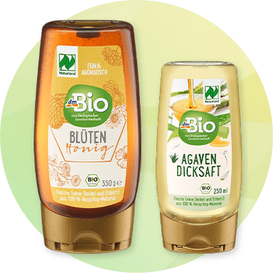Blütenhonig und Agavendicksaft in Flaschen von dmBio