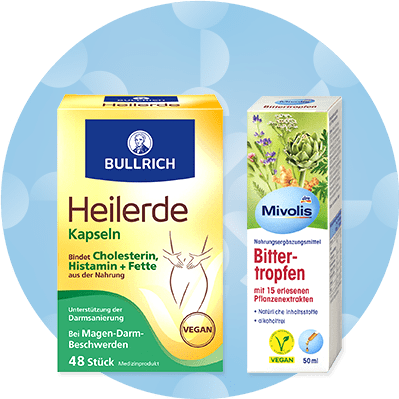 Zwei Produktverpackungen: Bullrich Heilerde Kapseln in gelber Schachtel, Mivolis Bittertropfen in weißer Schachtel mit Pflanzenillustrationen