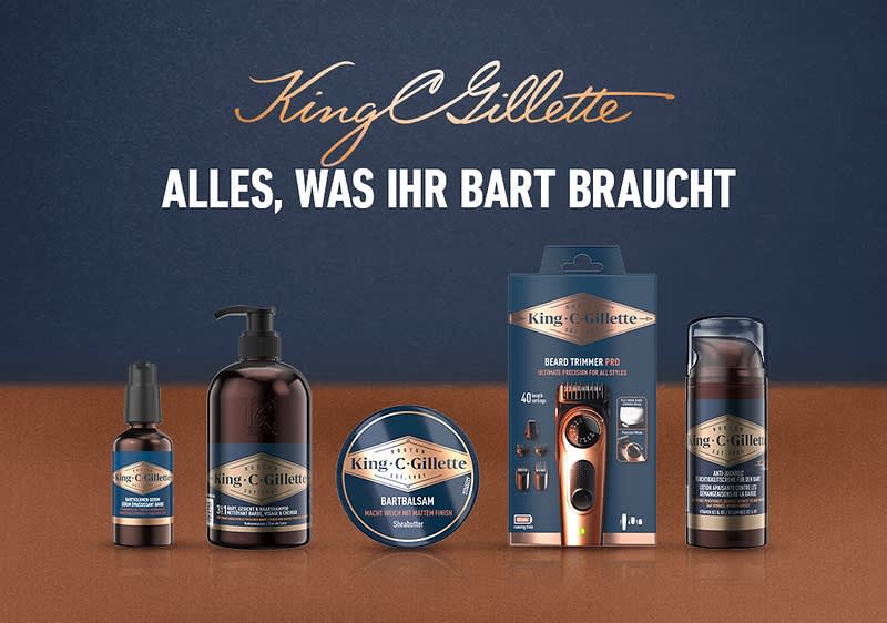 King C. Gillette Bartpflege-Serie mit Bartöl, Pump-Flasche, Bartbalsam, Barttrimmer in Verpackung und Rasierschaum nebeneinander, Slogan „Alles, was Ihr Bart braucht“