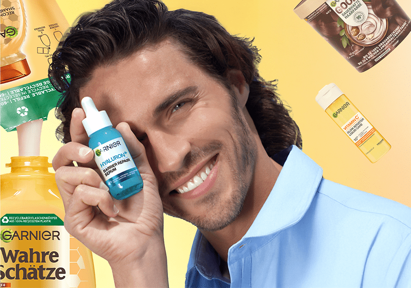 Haarpflegeprodukte von Garnier vor gelbem Hintergrund