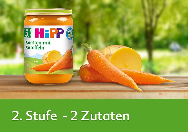 Hipp Babynahrung Karotten mit Kartoffeln im Glas mit frischen Karotten und Kartoffeln