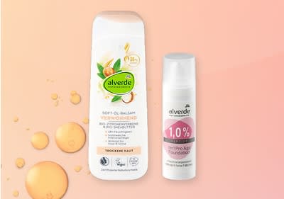 Alverde Hautpflegeprodukte mit Hibiskusblüten auf rosa Hintergrund