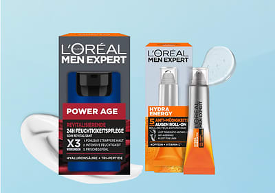 Zwei L'Oréal Men Expert Produktverpackungen: Power Age Feuchtigkeitspflege und Hydra Energy Augen Roll-On