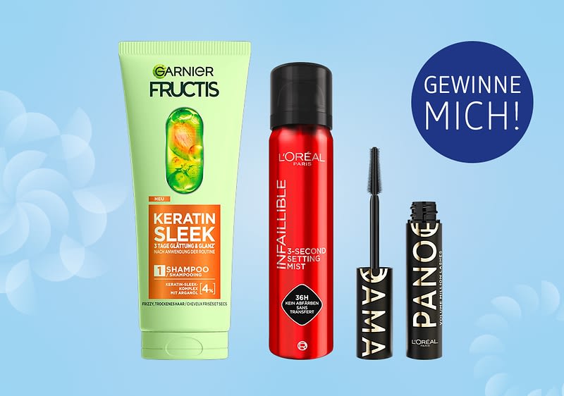 Eine Garnier Fructis Shampoo-Flasche, eine rote L'Oréal Paris Infallible Setting Spray-Flasche und eine L'Oréal Paris Mascara mit der Aufschrift „GEWINNE MICH!“