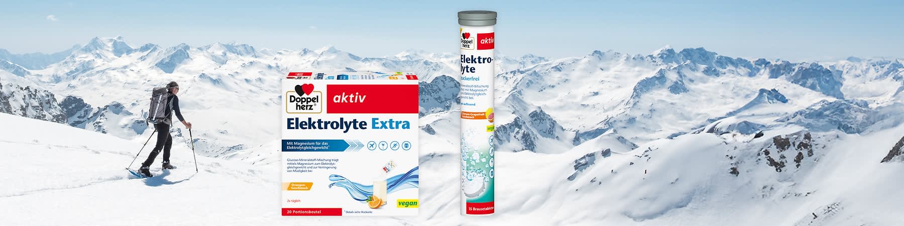 Zwei Produktverpackungen von Doppelherz: links eine Packung mit der Aufschrift „Elektrolyte Extra“, rechts eine Tube mit „Elektrolyte Zuckerfrei“