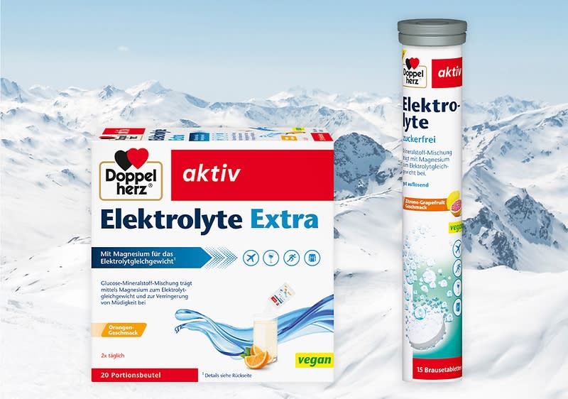 Zwei Produktverpackungen von Doppelherz: links eine Packung mit der Aufschrift „Elektrolyte Extra“, rechts eine Tube mit „Elektrolyte Zuckerfrei“