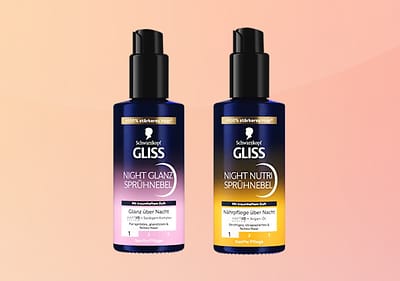 Zwei Flaschen Schwarzkopf Gliss Night Sprühnebel, links Glanz über Nacht in Rosa, rechts Nachtpflege über Nacht in Orange, beide mit Aufschrift für strapaziertes Haar
