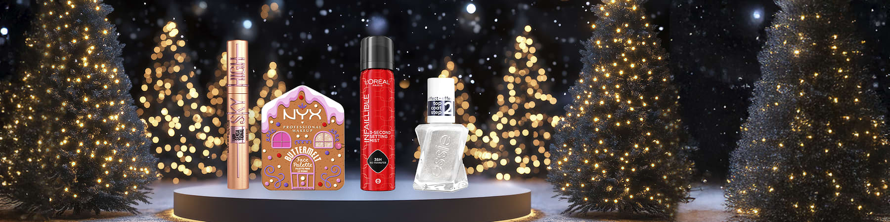 Vier Kosmetikprodukte vor einem funkelnden Hintergrund: Maybelline Sky High Mascara, NYX Butterme Gloss Palette, L'Oréal Infallible Setting Mist, Essie Top Coat 2