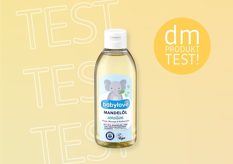 Eine Flasche babylove Mandelöl mit einem Elefanten auf dem Etikett, daneben der Text „dm Produkttest“ auf gelbem Hintergrund