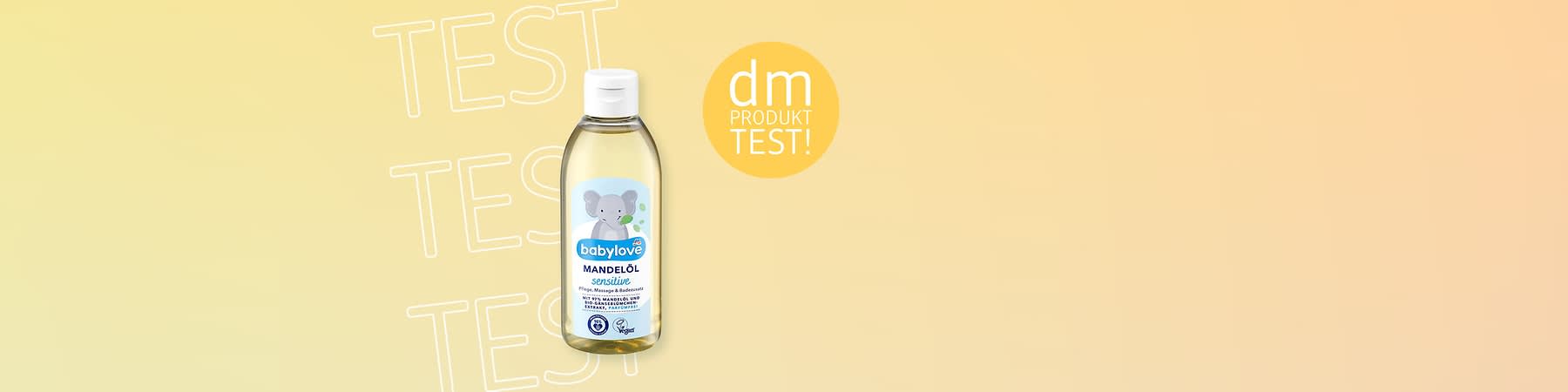 Eine Flasche babylove Mandelöl mit einem Elefanten auf dem Etikett, daneben der Text „dm Produkttest“ auf gelbem Hintergrund