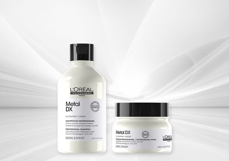 Zwei L’Oréal Professionnel Metal DX Haarpflegeprodukte: links weiße Shampoo-Flasche mit schwarzem Verschluss, rechts weißer Tiegel mit schwarzem Deckel und Produktbeschriftung