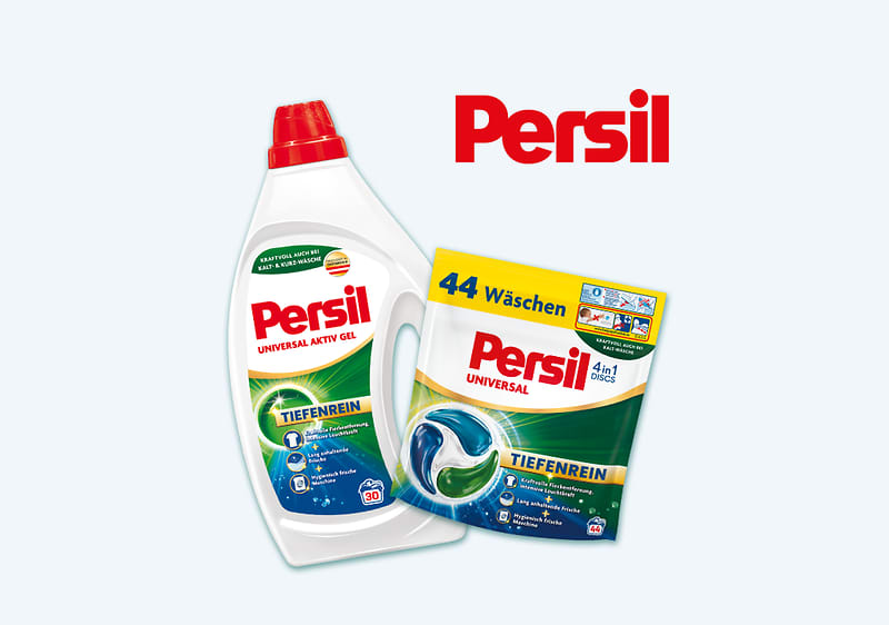 Frau mit wehendem dunklem Haar und weißer Kleidung, daneben eine weiße Flasche Persil Flüssigwaschmittel und eine Packung Persil Pulver „44 Wäschen“, rotes Persil-Logo oben rechts
