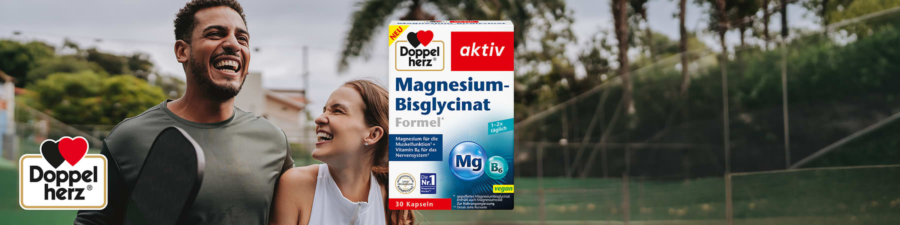 Zwei sportlich gekleidete Personen mit Paddeln neben einer Doppelherz aktiv Magnesium-Bisglycinat-Formel-Packung mit 30 Kapseln
