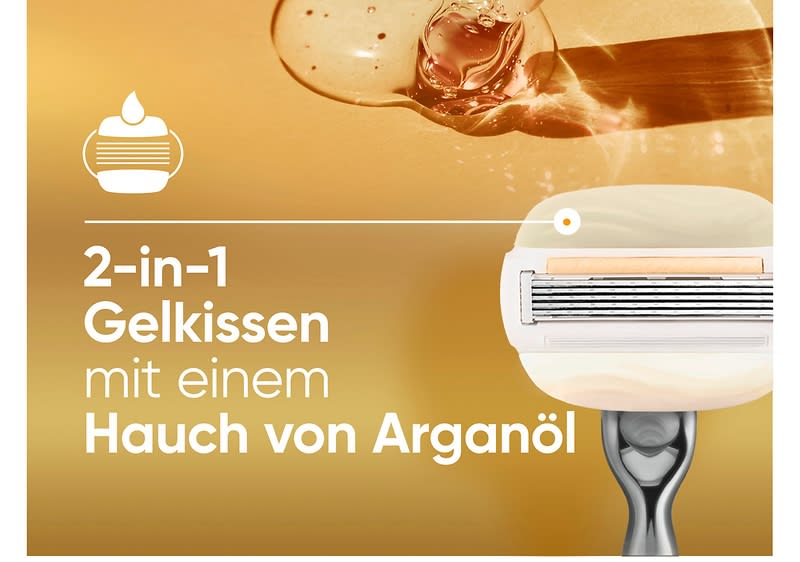 2-in-1 Gelkissen-Rasierklinge mit aufgesetztem Rasierkopf und Text „2-in-1 Gelkissen mit einem Hauch von Arganöl“, goldene Flüssigkeitstropfen im Hintergrund