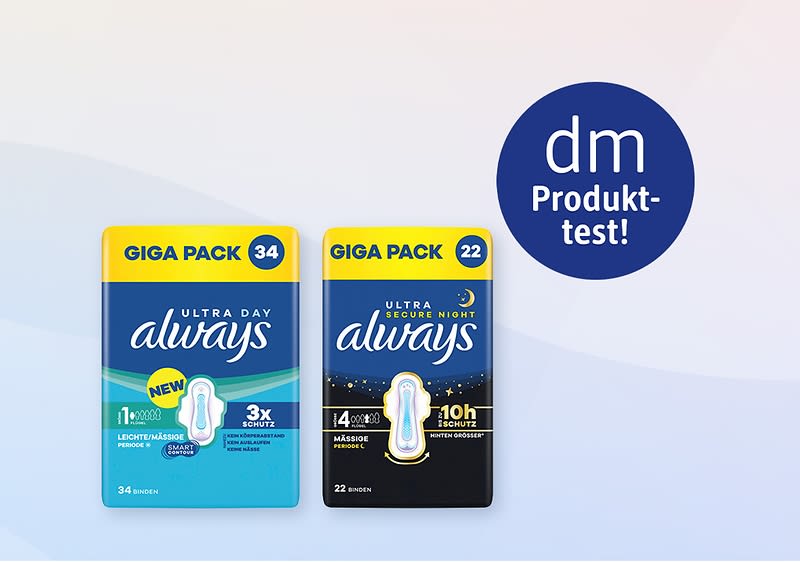 Zwei Always Damenbinden-Packungen nebeneinander: links hellblaues Giga Pack mit Aufdruck „34“, „Ultra Day always“, Hinweise „leichte Mäßige“, „3x Schutz“ und Symbol; rechts dunkles Giga Pack „22“, „Ultra Night always“, „10h Schutz“; oben rechts blauer Kreis mit Weißschrift „dm Produkt‑test!“