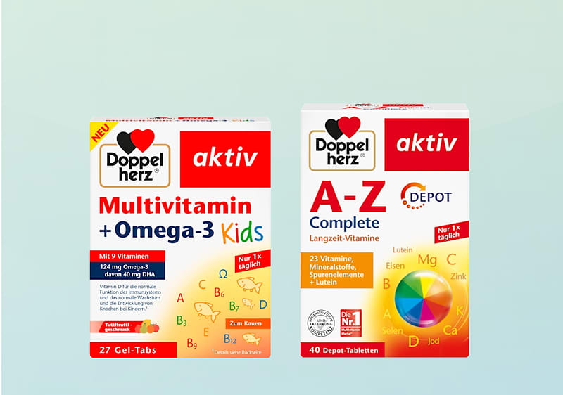 Zwei Produktverpackungen von Doppelherz aktiv nebeneinander: links rote und gelbe Packung „Multivitamin + Omega-3 Kids“ mit Hinweis „27 Gel-Tabs“ und kindlicher Schrift, rechts rote und weiße Packung „A-Z Complete Depot“ mit Farbkreis und „40 Depot-Tabletten“