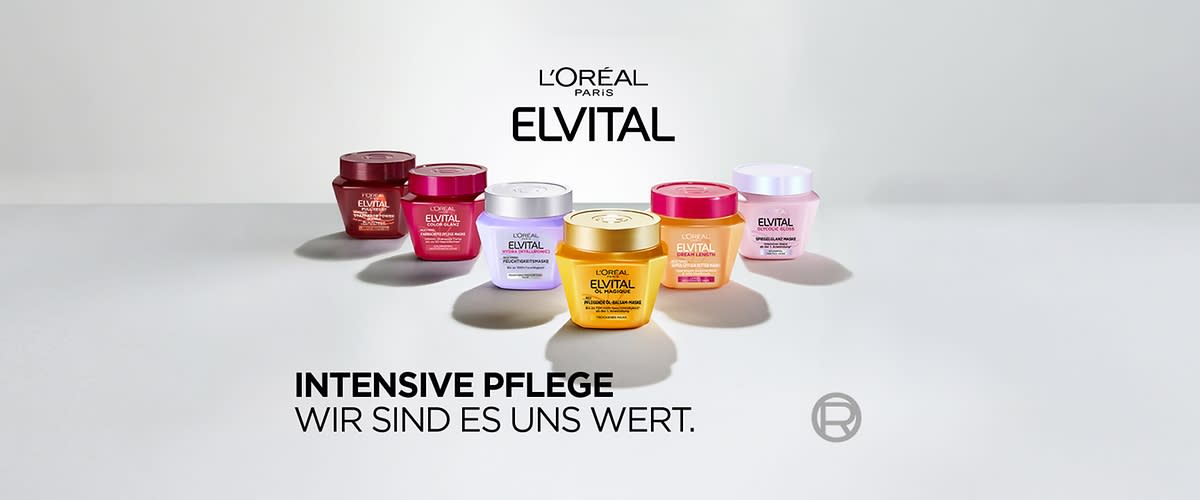 Sechs bunte Elvital Haarmasken-Tiegel von L’Oréal Paris auf hellgrauem Untergrund, vorne ein goldgelber Tiegel mit der Aufschrift „ELVITAL“ und daneben rosa, violett, orange und zwei rote Tiegel, darüber Logo „L’ORÉAL PARIS ELVITAL“, darunter Text „INTENSIVE PFLEGE WIR SIND ES UNS WERT“