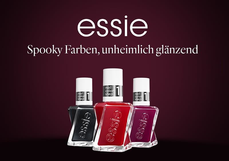 Drei Essie Nagellackflaschen in Schwarz, Dunkelrot und Dunkelviolett vor dunklem Hintergrund, darüber großer Markenname „essie“ und der Slogan „Spooky Farben, unheimlich glänzend“