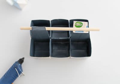 Rundholz an Geschenkbox befestigen