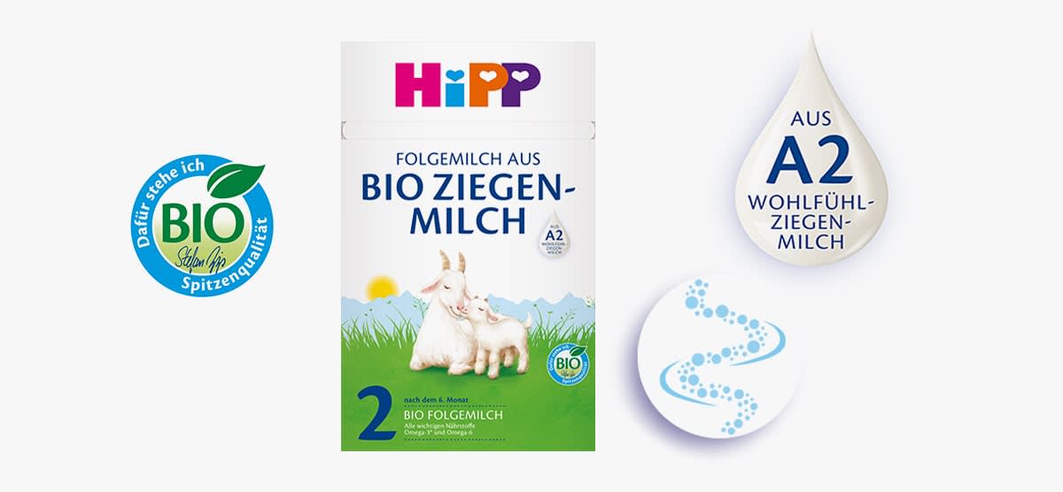 Produktverpackung der Marke HiPP für Bio Ziegenmilch Folgemilch mit zwei Ziegen auf einer grünen Wiese, Aufschrift „Folgemilch aus Bio Ziegenmilch“, daneben ein Tropfen mit „Aus A2 Wohlfühl-Ziegenmilch“