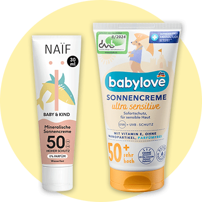 Eine gelbe Sonnenroller-Flasche von Sundance Kids mit Lichtschutzfaktor 50+ und eine weiße Tube Naïf Baby & Kind Mineralische Sonnencreme mit Lichtschutzfaktor 50 und 100 ml