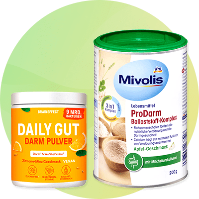 Eine Dose Daily Gut Darm Pulver mit Zitronen-Minz-Geschmack neben einer Dose Mivolis ProDarm Ballaststoff-Komplex mit Apfel-Geschmack