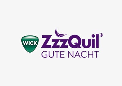Das Logo von Wick ZzzQuil Gute Nacht mit einem grünen Schild und lila Schriftzug