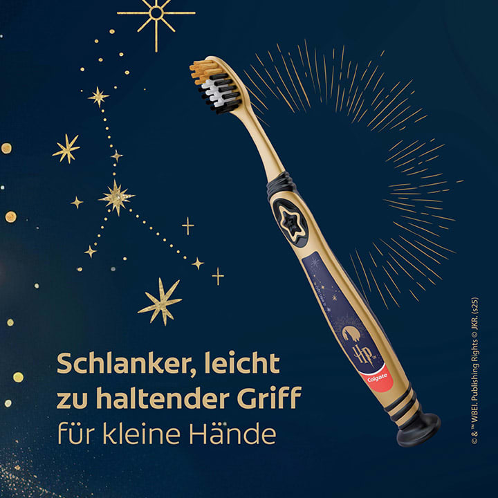 Goldfarbene Zahnbürste mit dunklem Borstenkopf und blauem Grifffeld, rechts Textteil „Schlanker, leicht zu haltender Griff“ auf dunkelblauem Hintergrund mit goldenen Sternmotiven