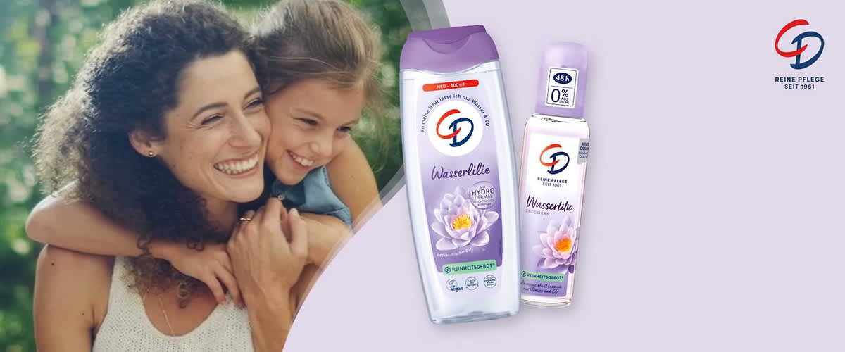 Zwei lila verpackte Körperpflegeprodukte der Marke CD mit Aufschrift „Wasserlilie“: links eine Duschgel-Flasche mit lila Deckel und Lotusblumen-Motiv, rechts ein Deodorant-Spray mit lila Kappe und Aufdruck „48h 0%“ sowie CD-Logo oben rechts