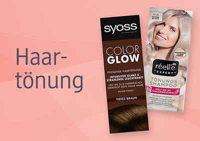 Zwei Haarfärbemittel-Packungen auf rosa Hintergrund