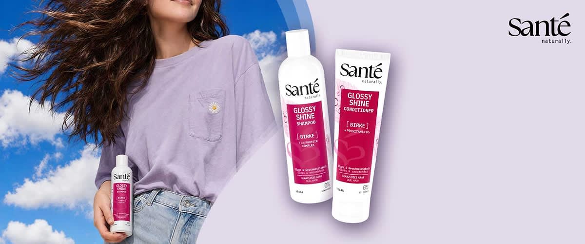 Zwei weiße Sante-Flaschen mit pinken Etiketten, links „Glossy Shine Shampoo [Birke]“, rechts „Glossy Shine Conditioner [Birke]“, Markenlogo Sante oben rechts
