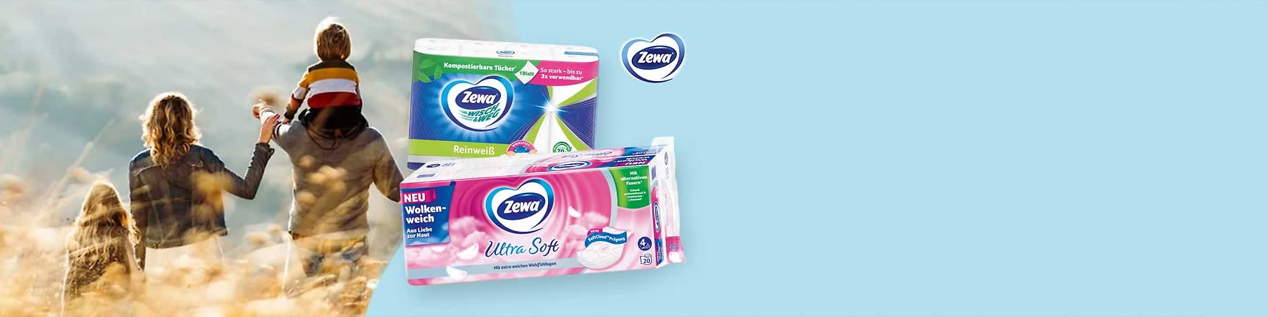Zwei Zewa-Papierverpackungen: vorne eine pink-weiße Packung „Zewa Ultra Soft“ mit Wolkenmotiv und Aufschrift „Neu Wolkenweich“, hinten eine grün-weiß-blaue Packung „Zewa Reinweiß“ 