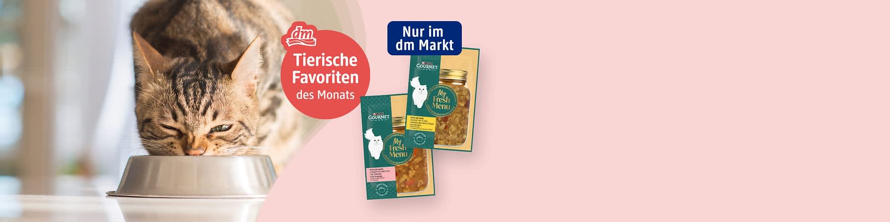 Teil einer Produktverpackung mit GlasHonig im Schraubglas und grünem Etikett links oben vor rosa Hintergrund