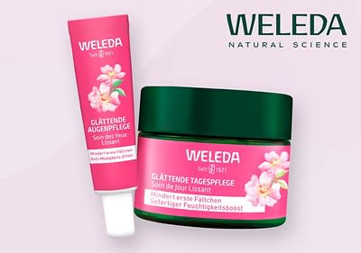 Zwei Weleda-Produkte mit rosa Verpackung und Blumenmotiv, links eine Tube mit der Aufschrift Glättende Augenpflege und rechts ein Tiegel mit der Aufschrift Glättende Tagespflege, beide mit dem Hinweis auf sofortigen Feuchtigkeitsboost, im Hintergrund der Schriftzug WELEDA Natural Science