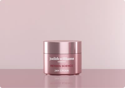 Rosa Cremedose auf rosa Hintergrund