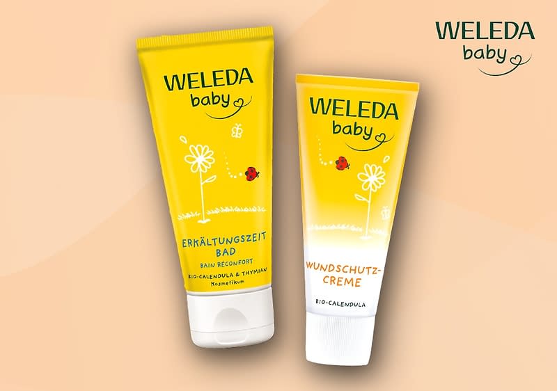 Zwei gelbe Weleda Baby Produktverpackungen, links Erkältungszeit Bad mit roter Blume und rechts Wundschutzcreme mit roter Blume, beide mit Bio-Calendula und Eryngium