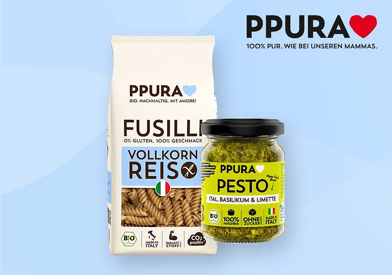 Packung Vollkornreis-Fusilli und Glas Pesto