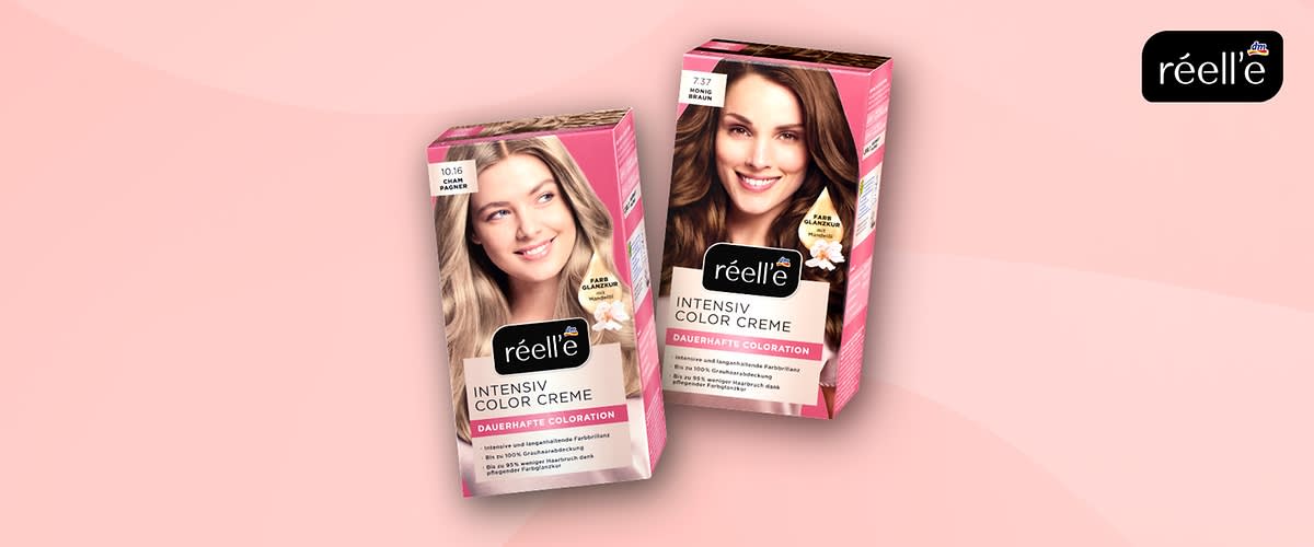 zwei pink-weiße Packungen Haartönung der Marke „réell’e“ mit der Aufschrift „INTENSIV COLOR CREME DAUERHAFTE COLORATION“, links hellblonde Nuance 10.16, rechts braune Nuance 7.37, Logo oben rechts auf rosa Hintergrund