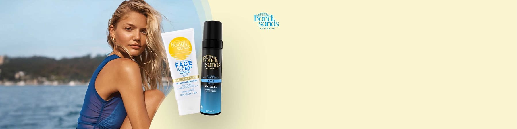 Zwei Bondi Sands Pflegeprodukte auf hellem Hintergrund: links eine weiße Tube „FACE SPF 50+ Everyday Lotion No Added Fragrance“ mit gelbem Logo, rechts eine schwarze-blaue Sprühflasche „Bondi Sands Express Self Tanning Foam Dark“ mit goldenem Schriftzug