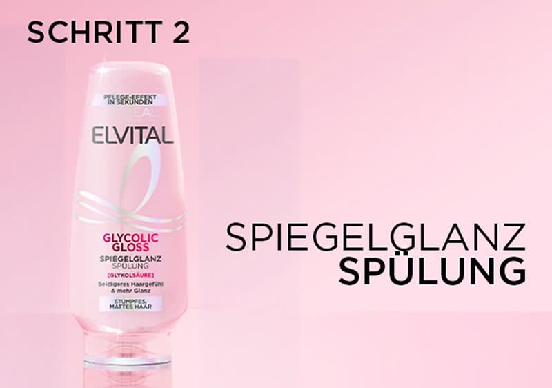 Eine rosa Flasche der Marke Elvital mit der Aufschrift Glycolic Gloss Spiegelglanz Spülung und Schritt 2 oben links, daneben steht Spiegelglanz Spülung in großen schwarzen Buchstaben auf einem rosa Hintergrund, die Flasche hat einen transparenten Deckel und die Aufschrift Für intensiven Haarspiegel mit mehr Glanz ist ebenfalls sichtbar.