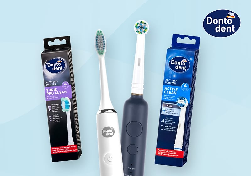 Zwei elektrische Zahnbürsten von Dontodent, eine in Weiß und eine in Dunkelblau, stehen vor ihren Verpackungen mit der Aufschrift „Sonic Pro Clean“ und „Active Clean“